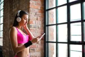 a young lady wearing headphones 