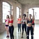 group of people exercising with dumbbells for best fitness exercise