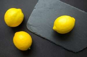 three yellow lemons