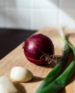 a red onion and garlic for quinoa stuffed bell peppers recipe